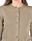 khaki cotton cardigan with a mandarin collar, mother-of-pearl buttons, and fine lurex jacquard detailing, styled with a matching lurex pleated skirt.