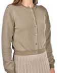 khaki cotton cardigan with a mandarin collar, mother-of-pearl buttons, and fine lurex jacquard detailing, styled with a matching lurex pleated skirt.